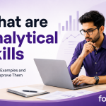 What are Analytical Skills blog banner showing a professional analysing information with data visualisations and workplace graphics in the background.